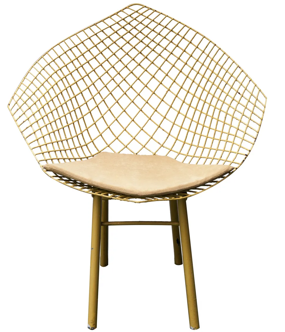 Three antique garden armchairs with lattice design and light cushion, in a relaxing setting.