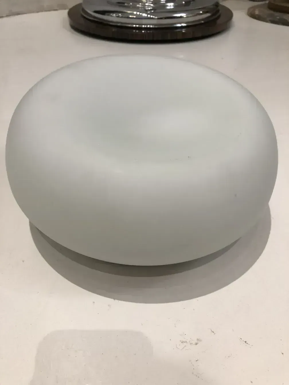antique round ceiling light with simple design in a dark setting
