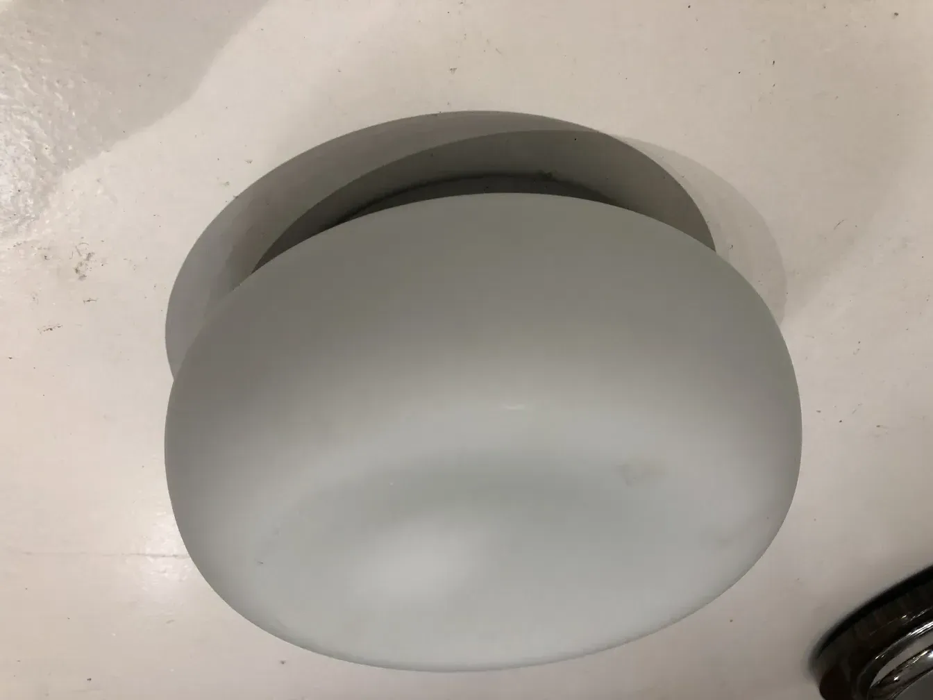 antique ceiling light with smooth rounded design