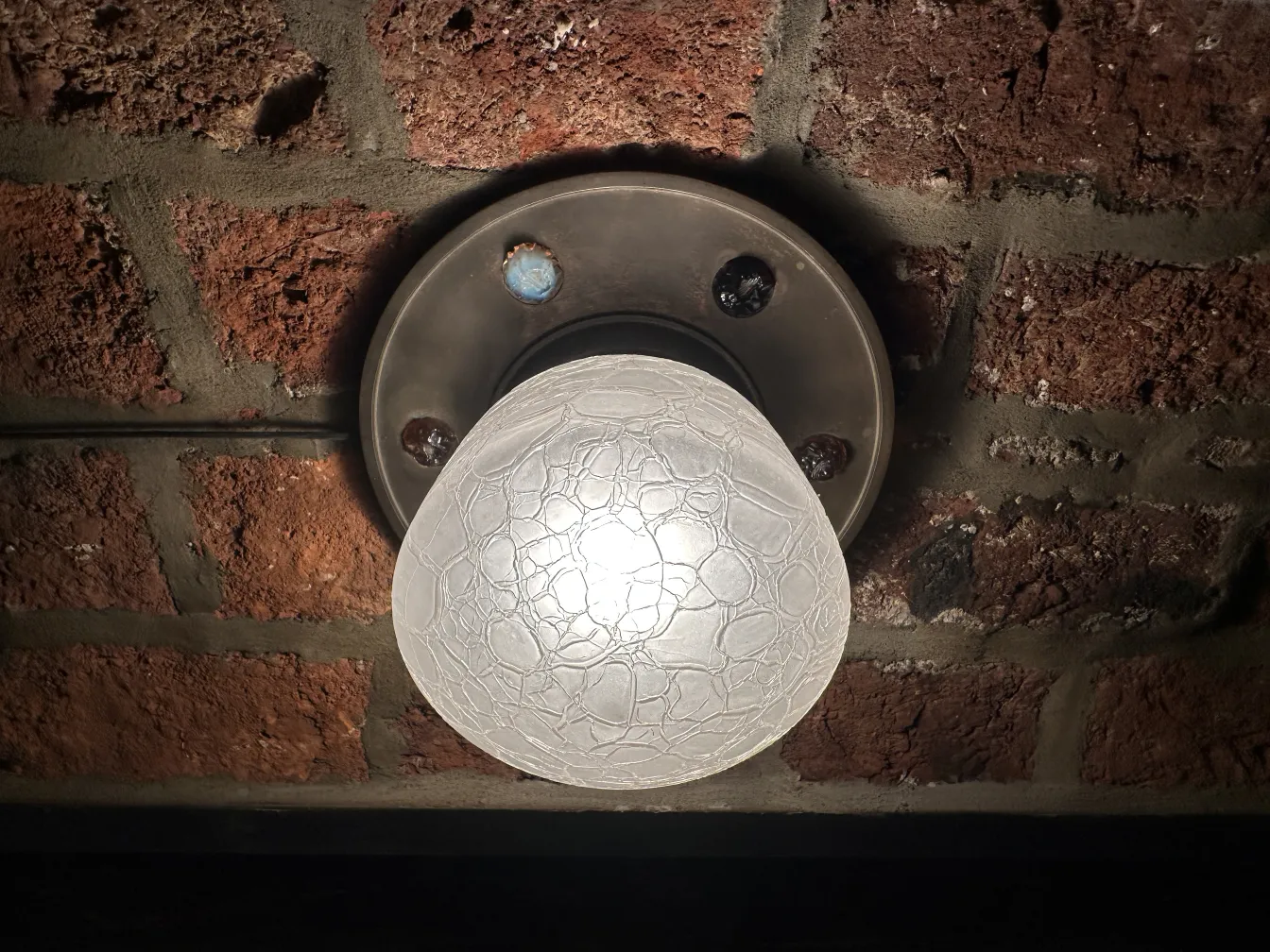 antique ceiling light with soft glow, circular base