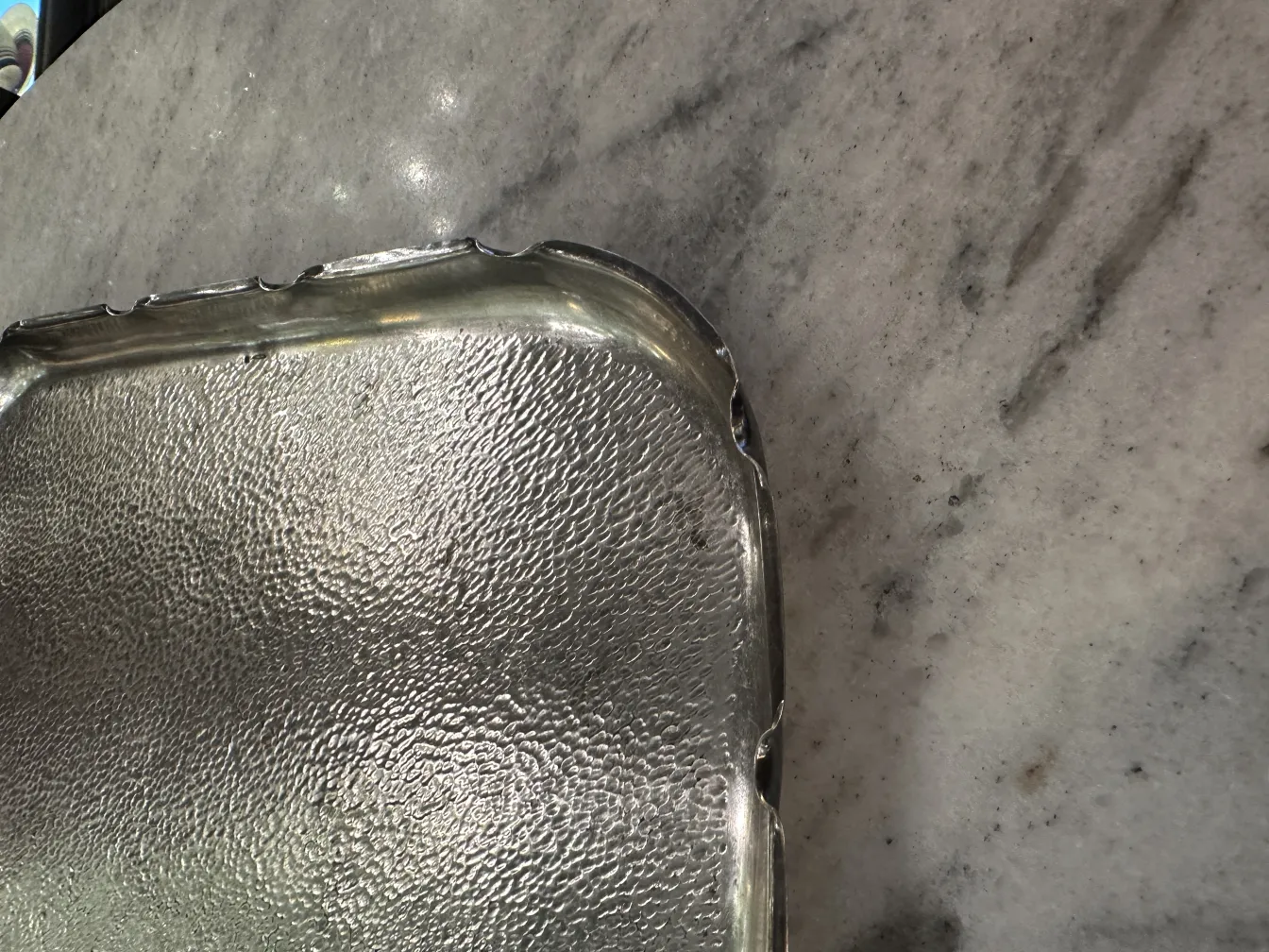 antique tray with decorative edges on surface