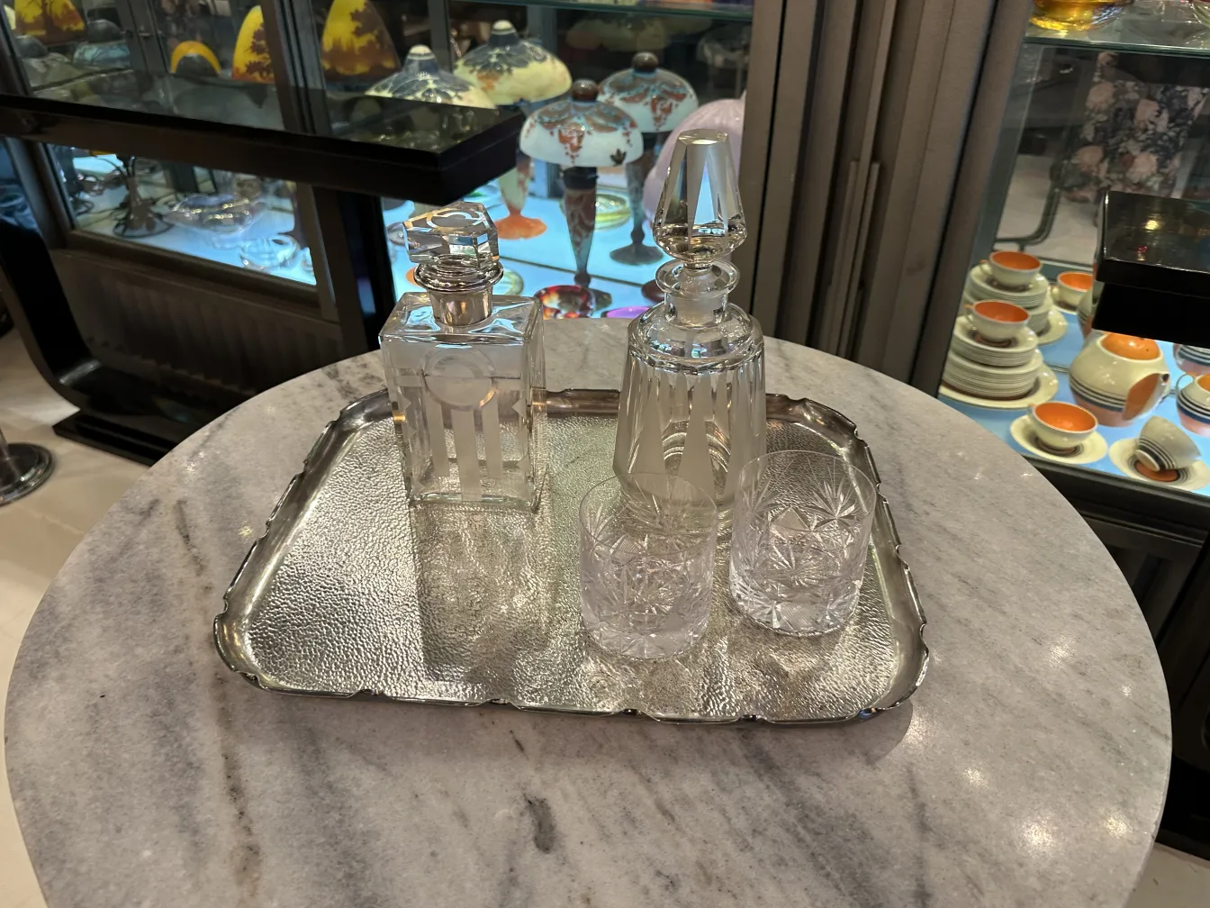 antique tray decorated with crystals and bottles