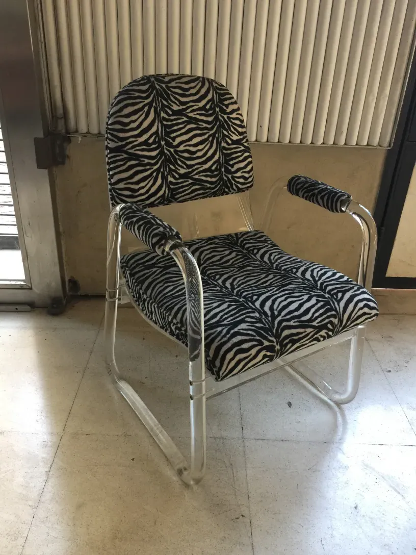 Antique armchairs with zebra print in a modern setting