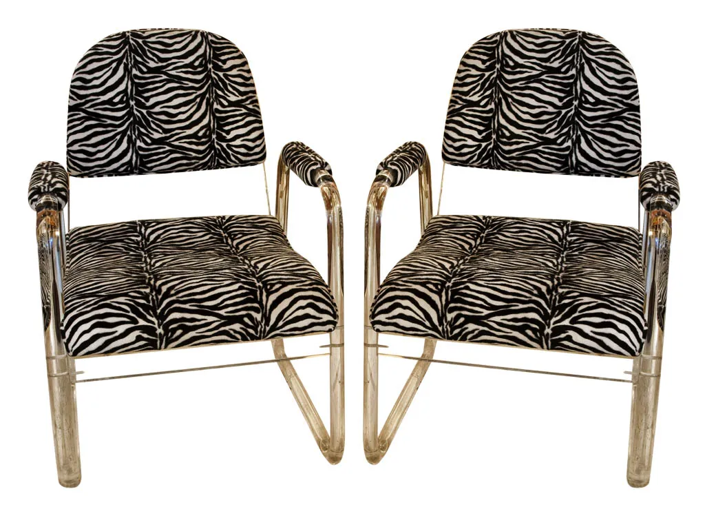 Set of 2 antique armchairs with zebra pattern in a classic setting