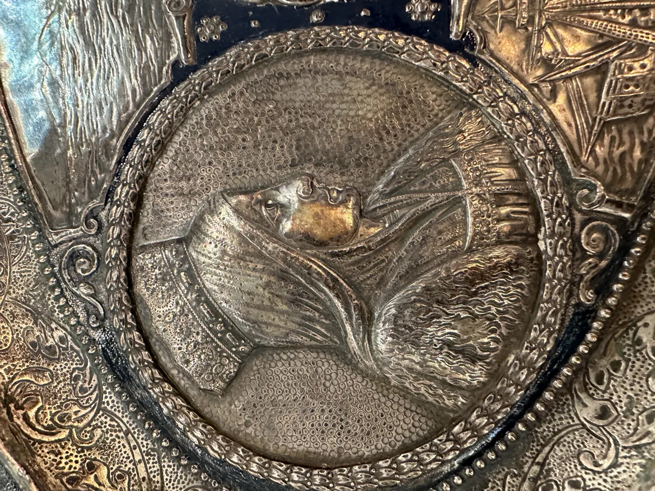 antique wall plate with relief and decorative details in a nostalgic setting