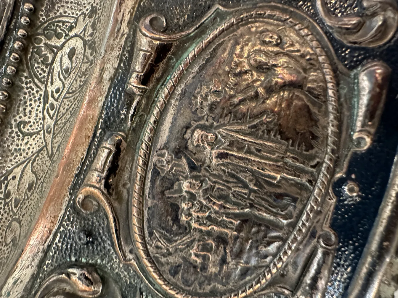 detail of antique wall plate with decorative reliefs