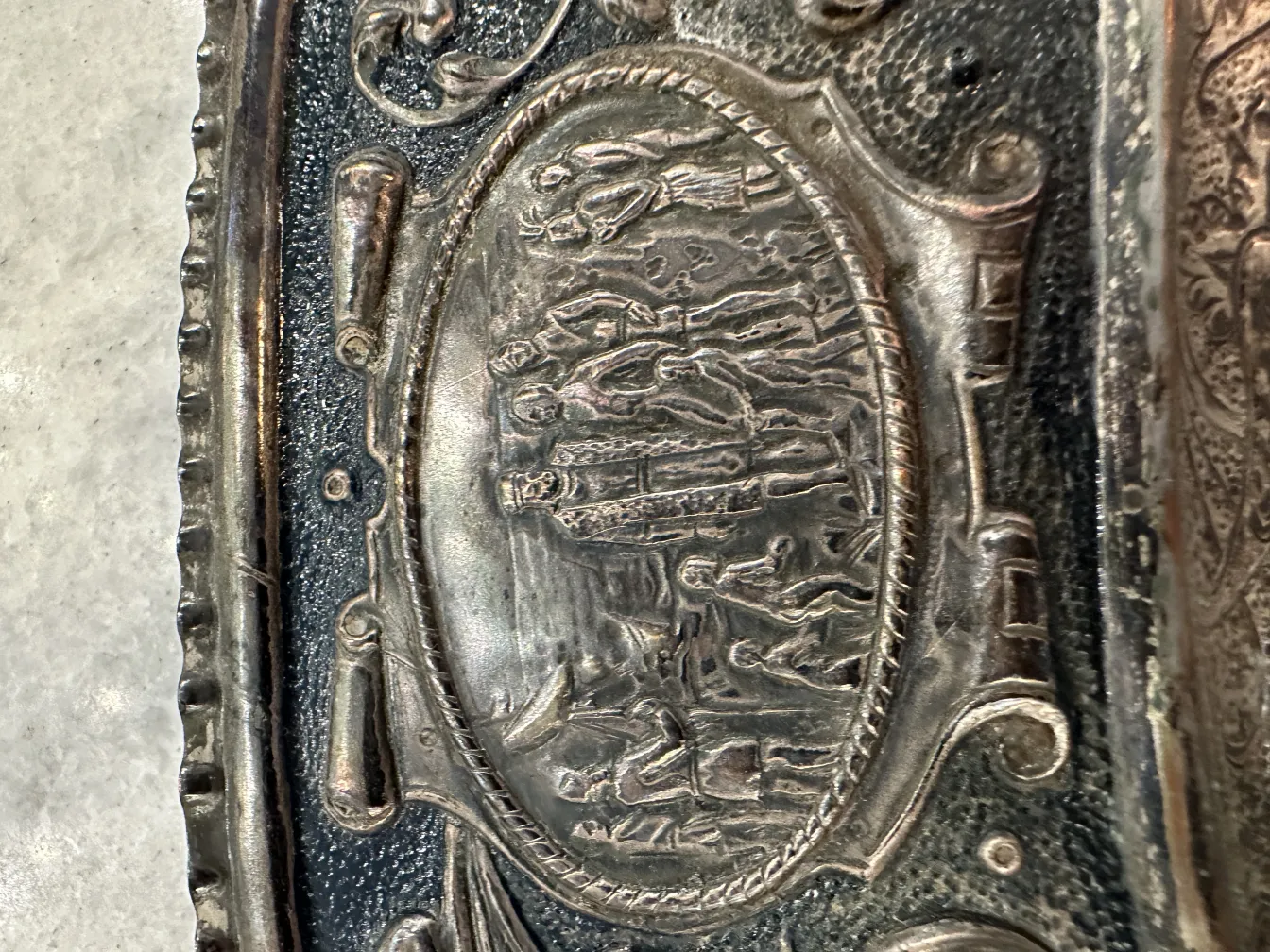 antique wall plate with raised sculptural details