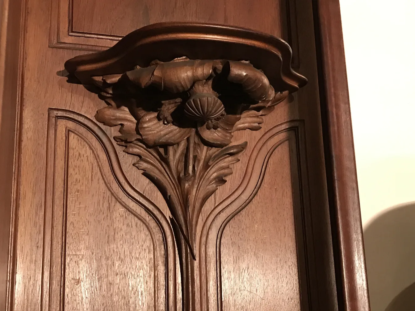 intricate carvings on the antique display cabinet E.Dienst - Paris.