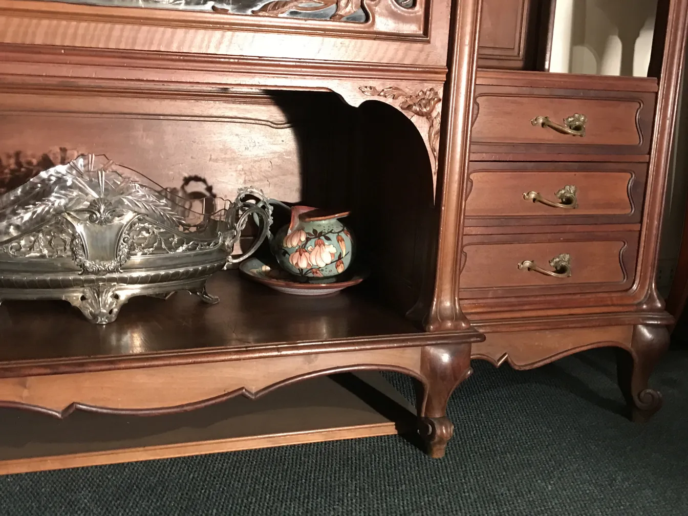 Antique display cabinet by E.Dienst - Paris featuring decorative details for showcasing items.