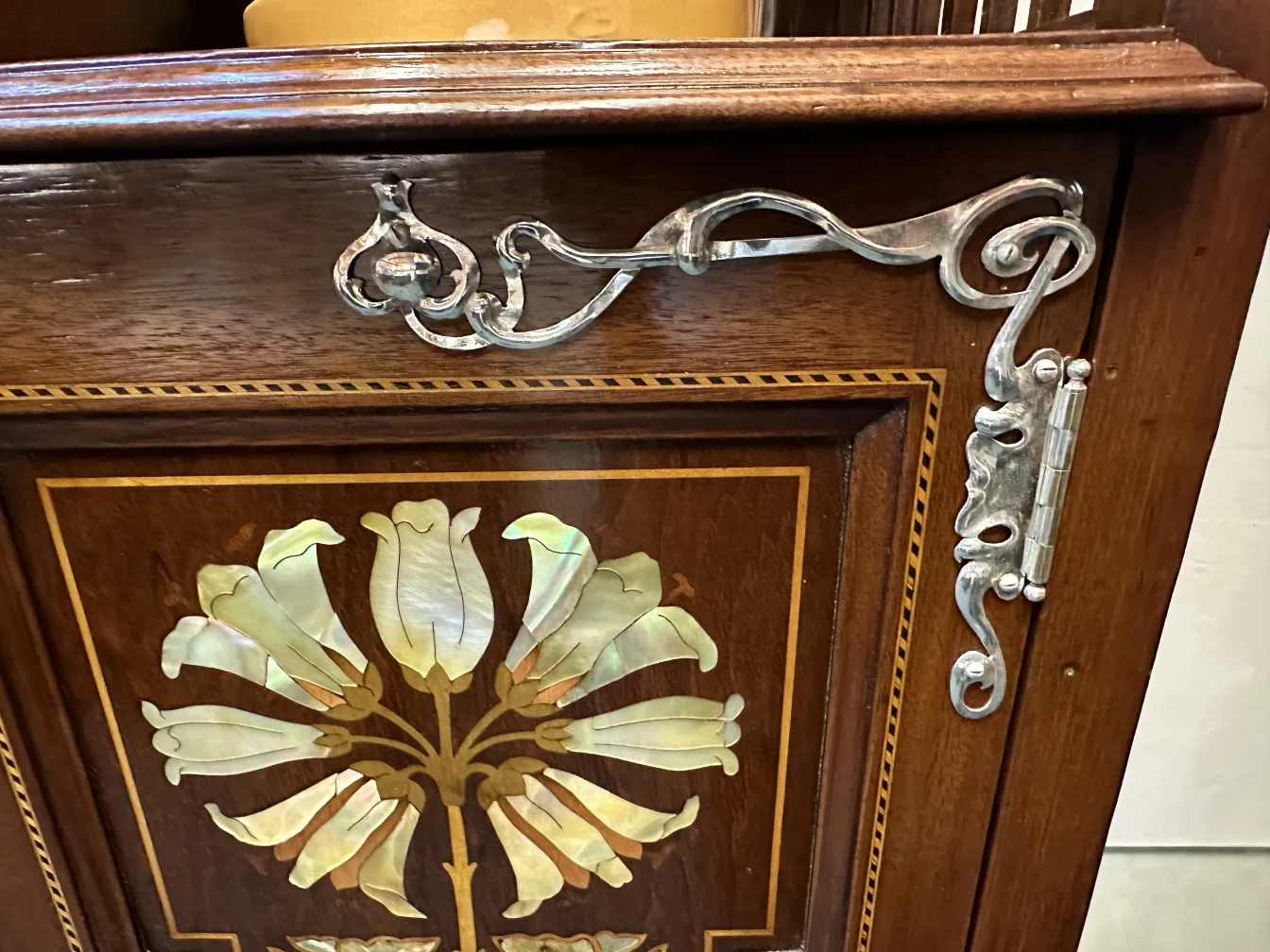 antique display cabinet with elegant decorative details