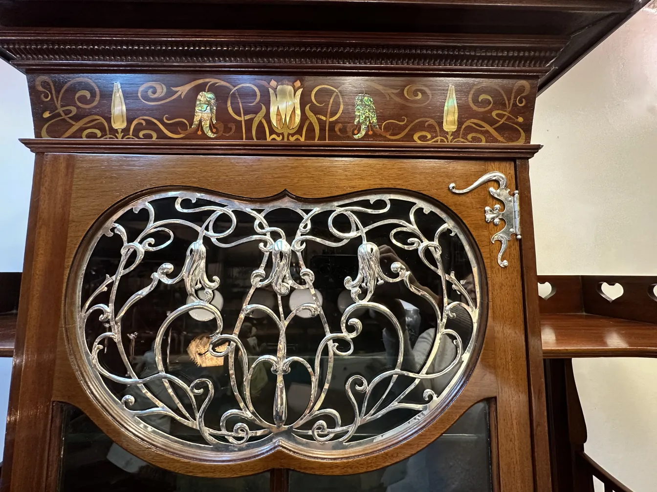 antique display cabinet with intricate decorative details
