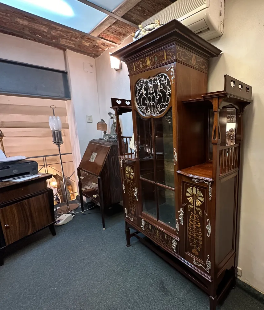 antique display cabinet by Shapland & Petter with decorative details
