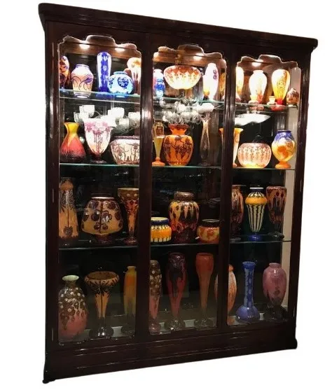 antique display cabinet with colorful decorative vases