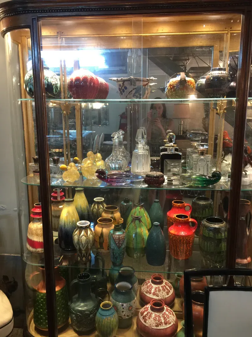 antique display cabinet with colorful and elegant decorations