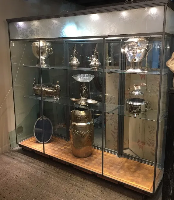 Antique display cabinet showcasing collectible items.