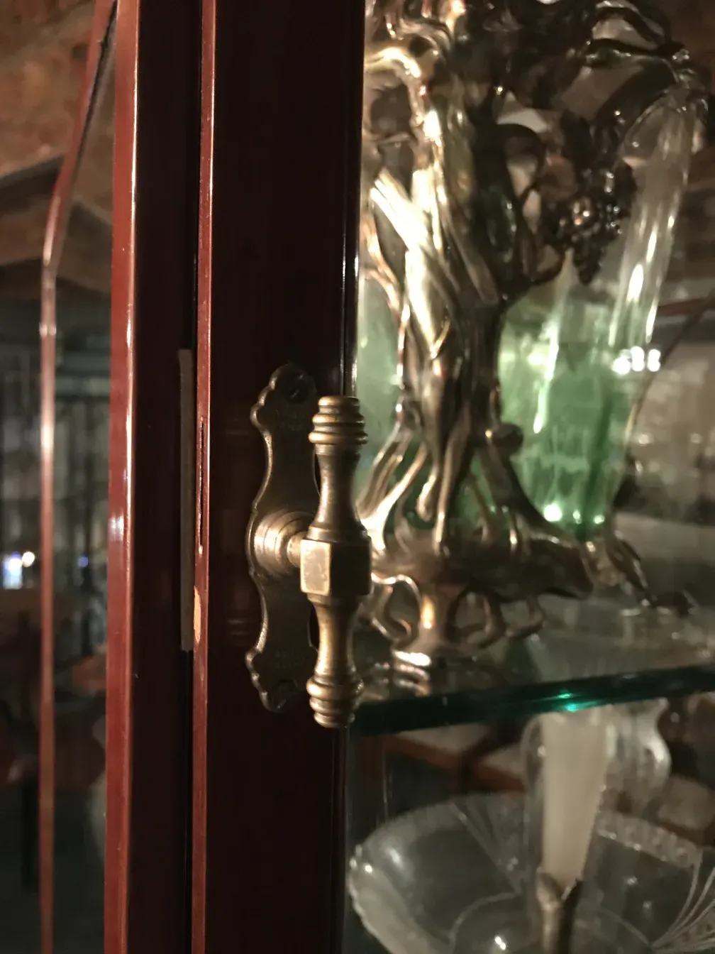 antique display cabinet with lock and lovely decorations