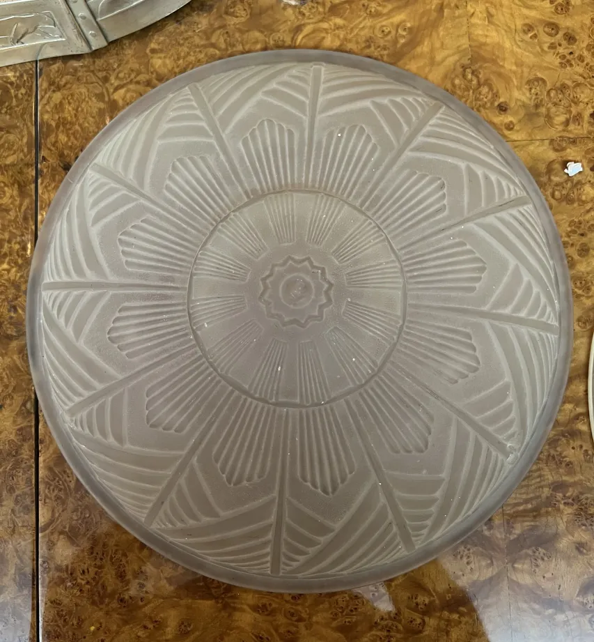 antique ceiling light with floral design and geometric shapes
