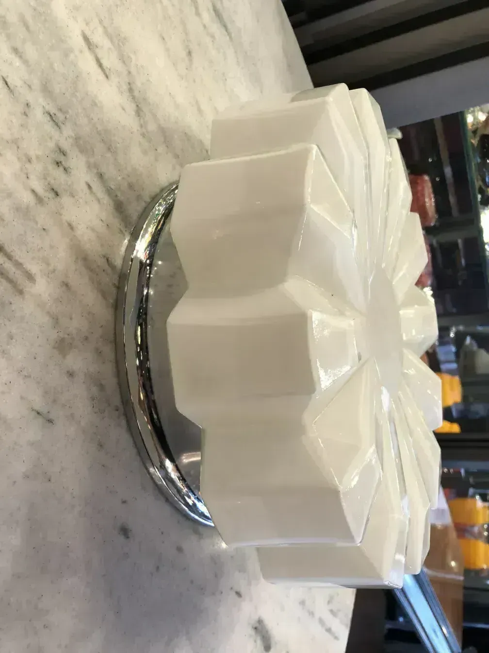 Antique ceiling light with angular design in elegant setting
