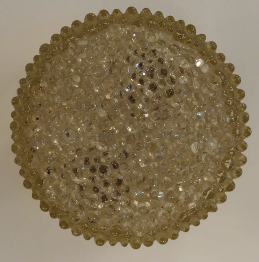 round antique ceiling light with bright details