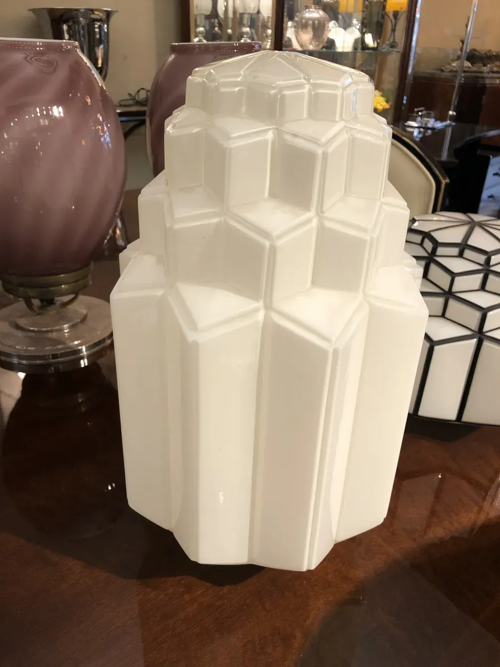 Two antique ceiling lights with geometric design and decorative background