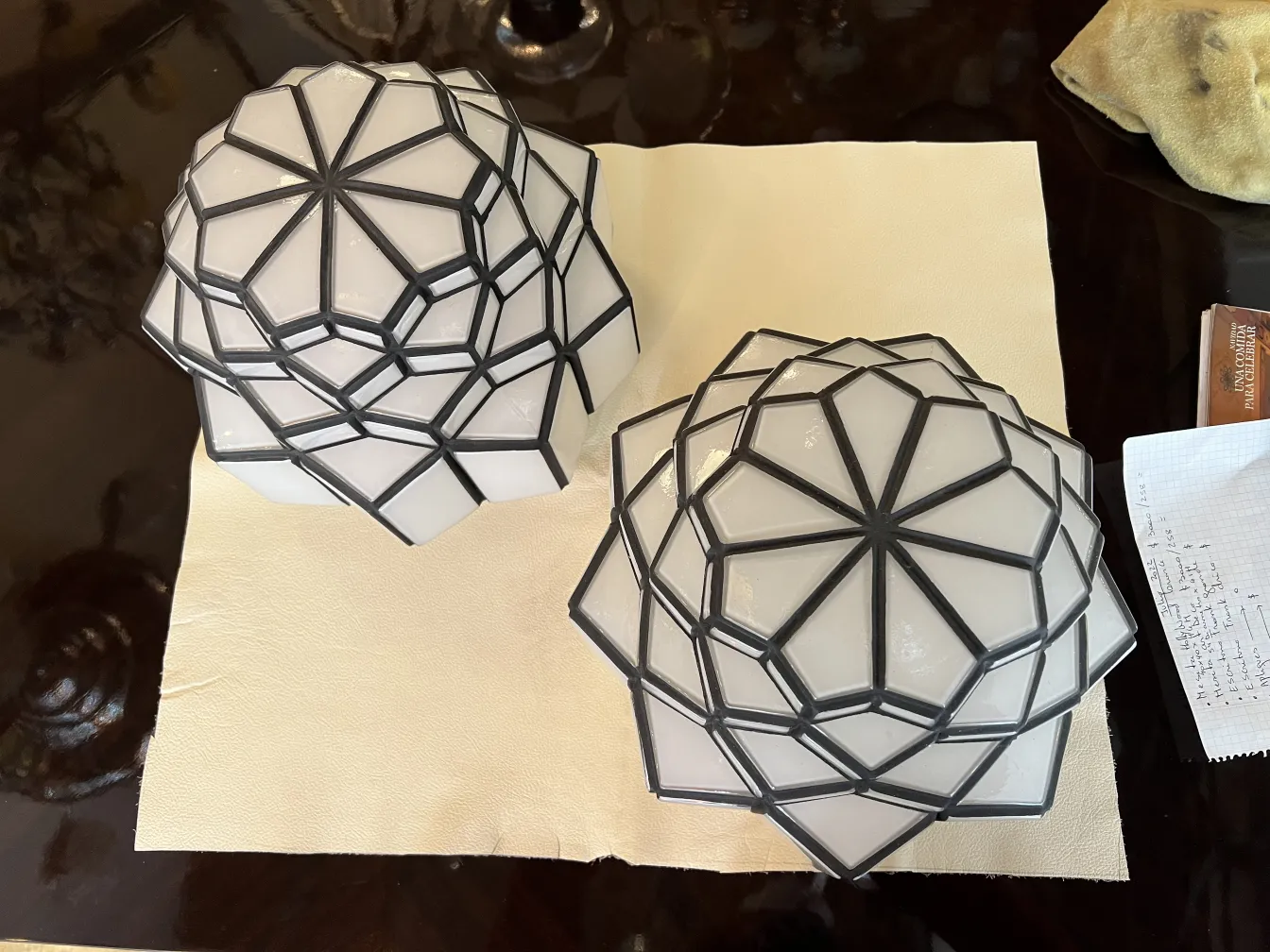 top view of two antique ceiling lights with geometric design