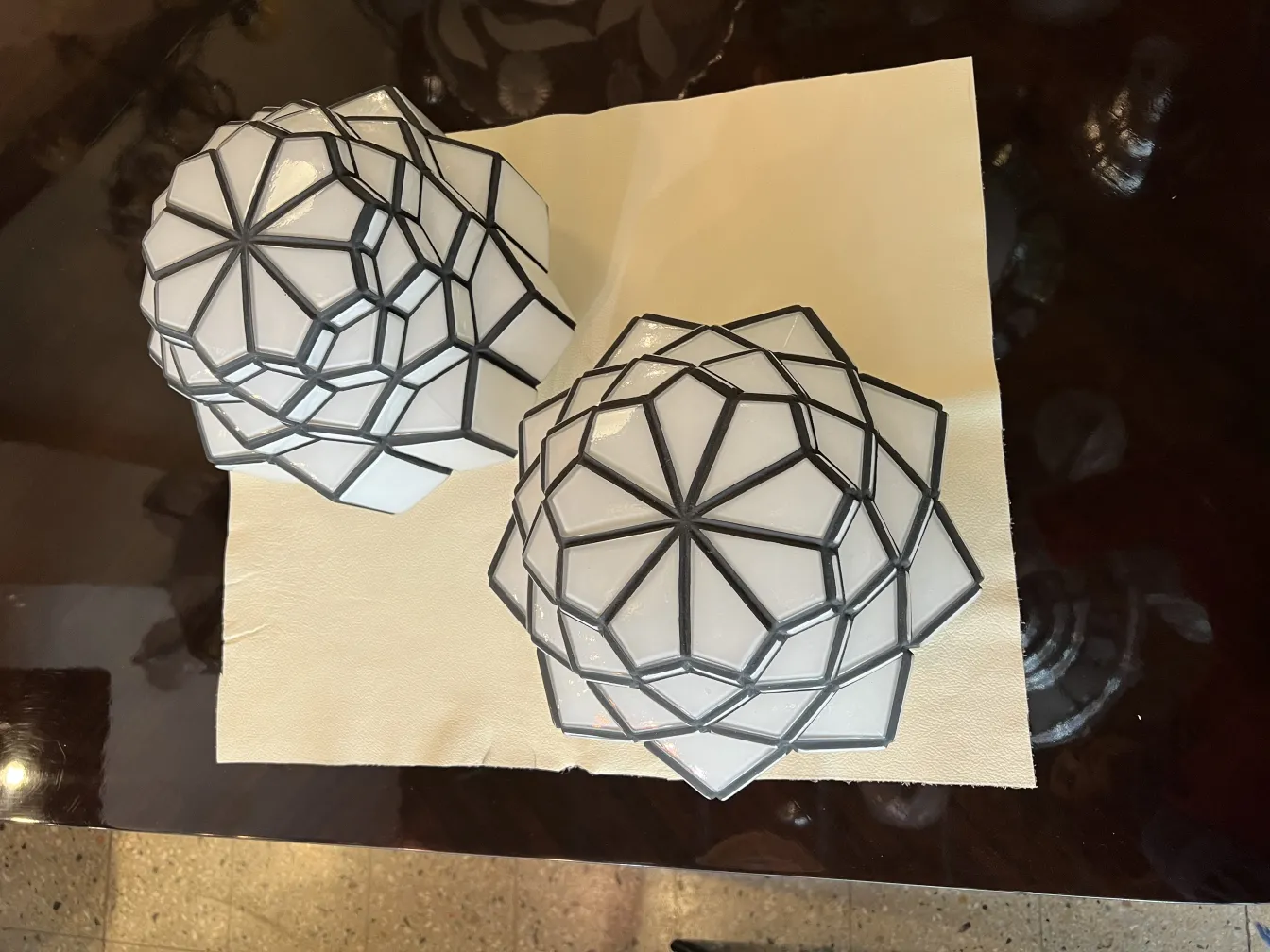two antique ceiling lights in decorative geometric shape