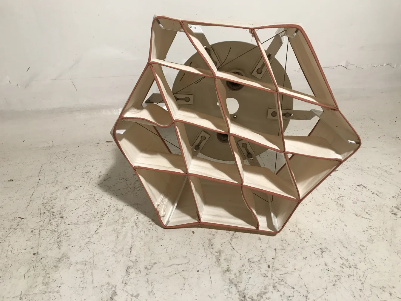 Two antique ceiling lights with distinctive geometric shapes