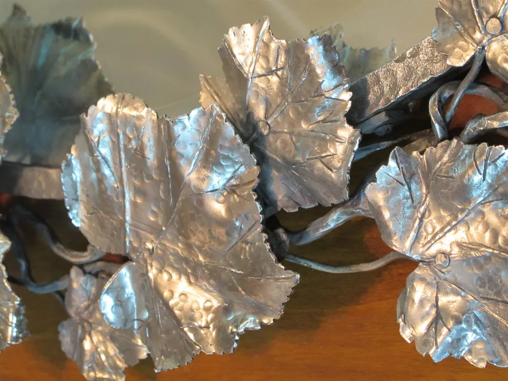 antique tray with polished metal leaves and fine details