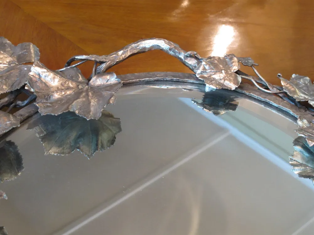 Antique tray adorned with leaves and natural details