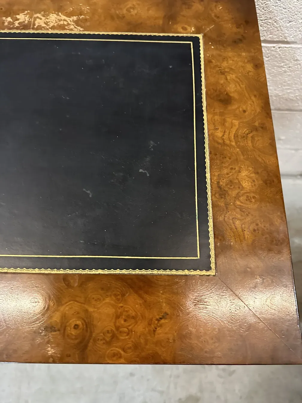 antique console with golden details and elegant design