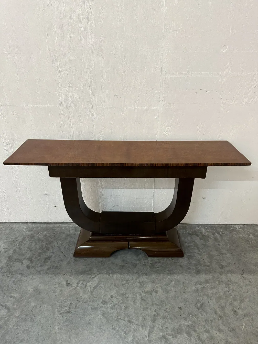 antique console table featuring an elegant design