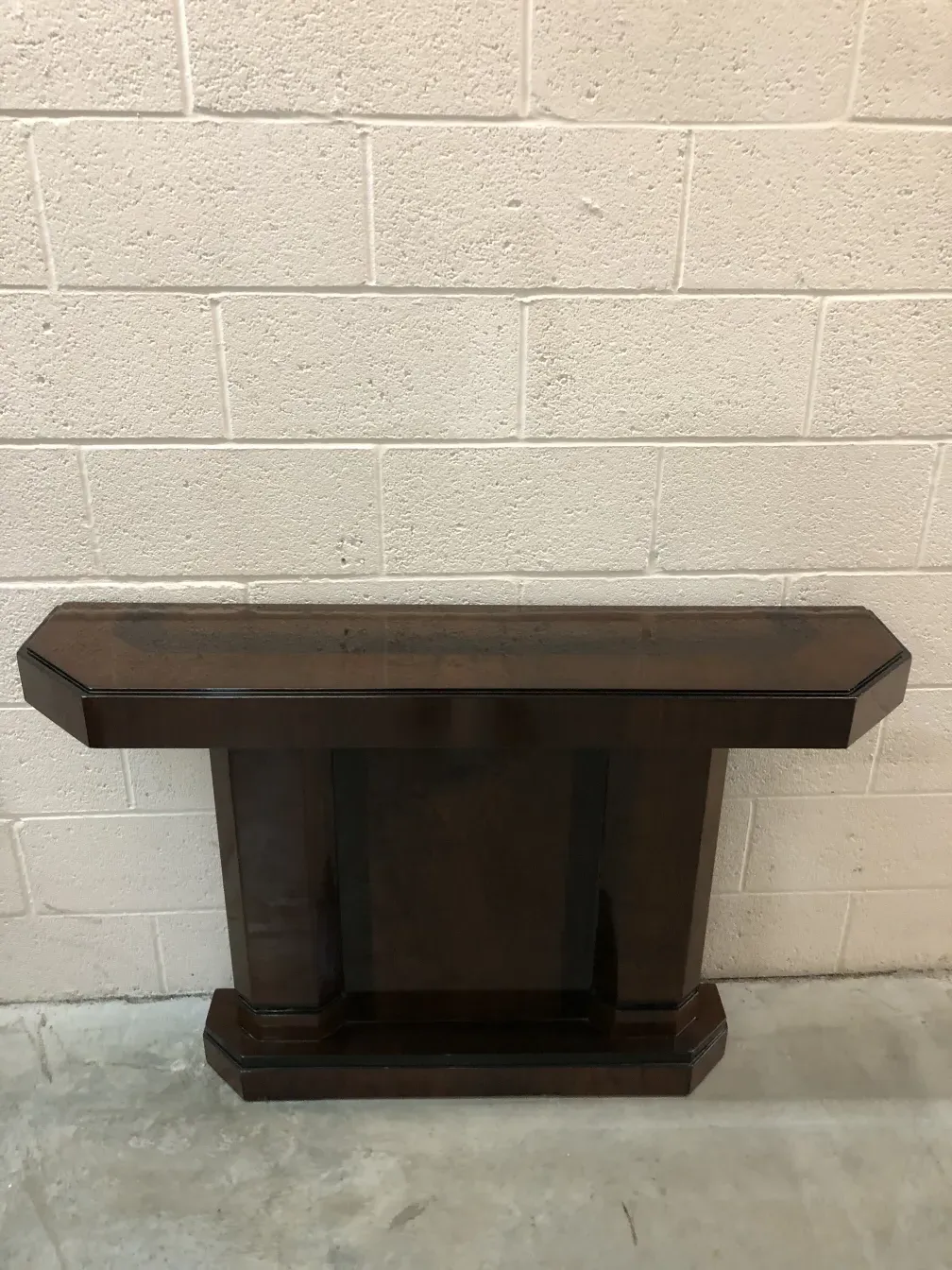 two antique consoles with simple design in a bright setting