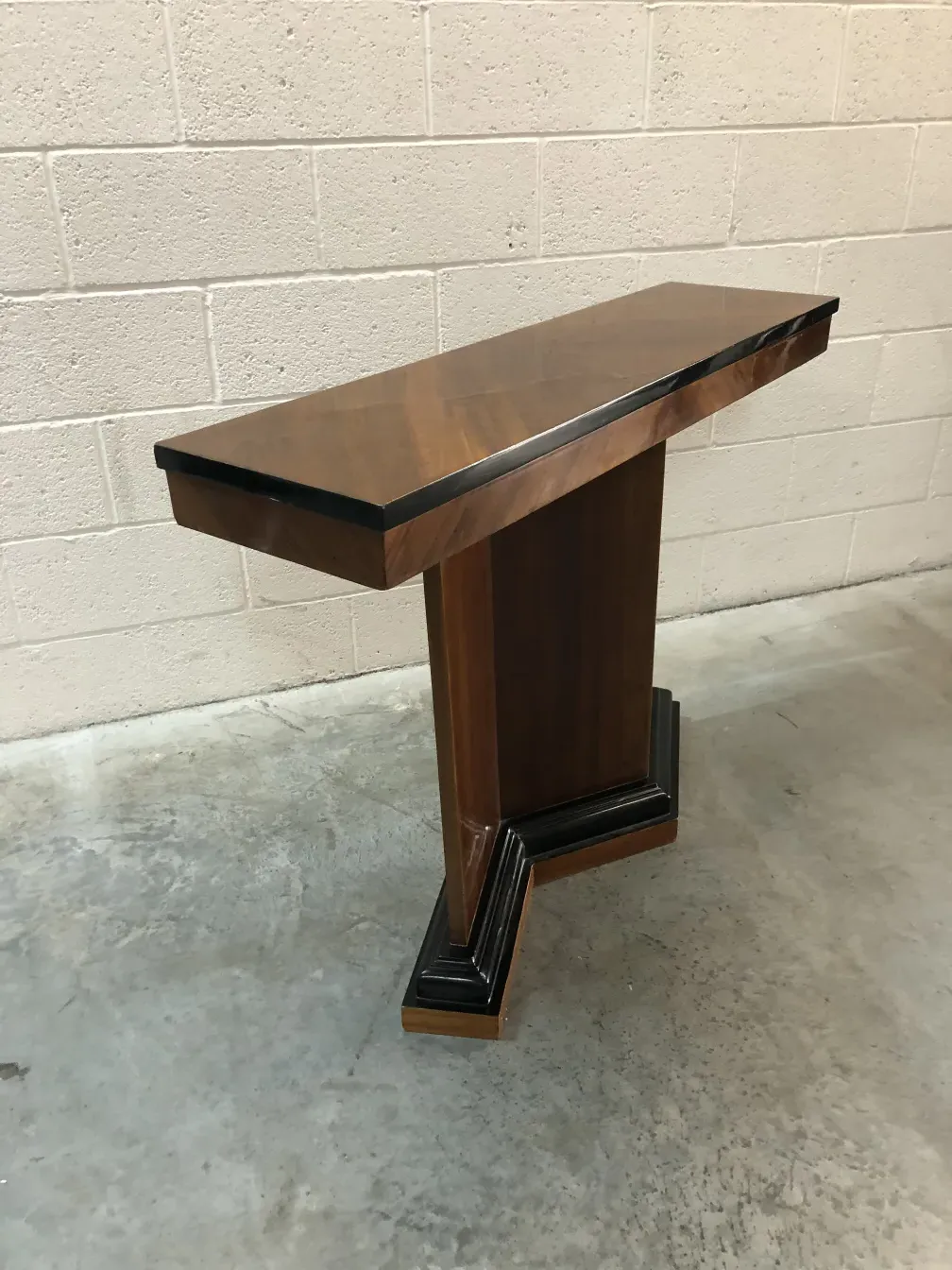 Side view of two antique consoles with distinctive details