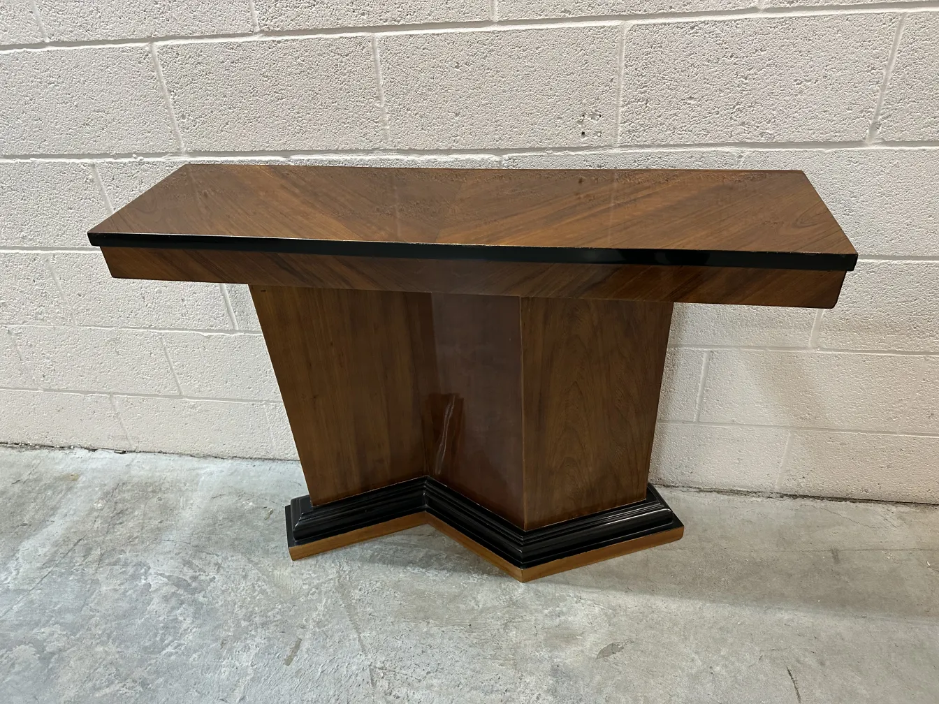 side view of two antique consoles in a decorative setting