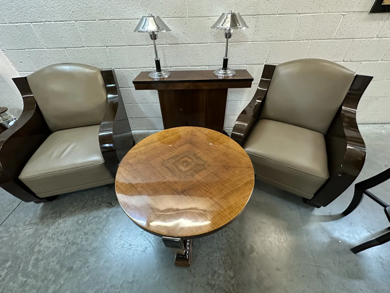 two antique consoles in a cozy setting with chairs