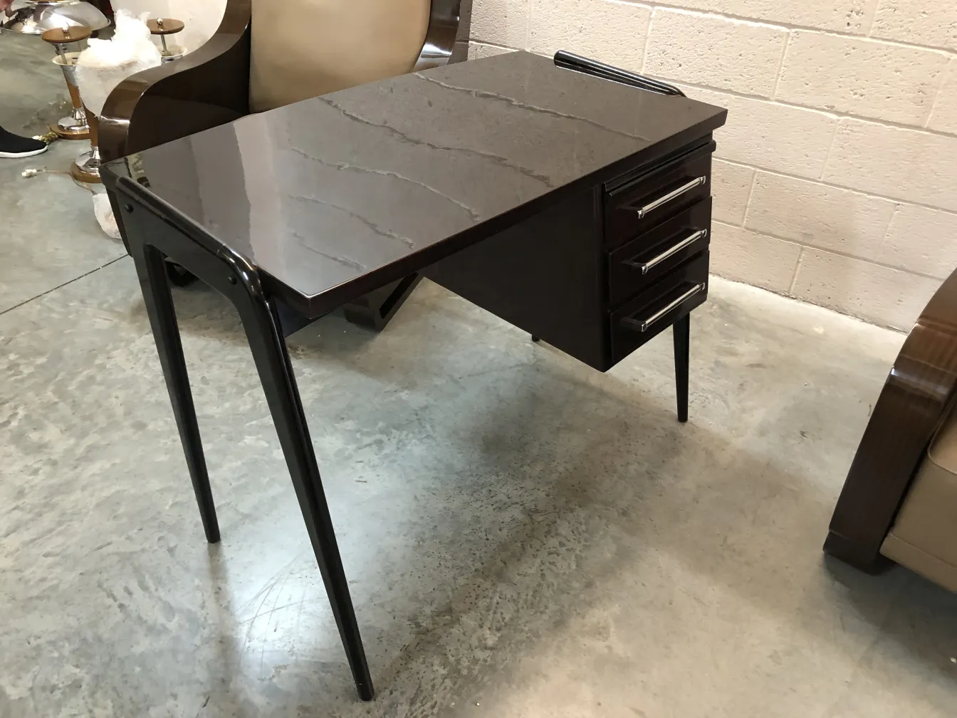 elegantly designed antique desk with drawers in a modern setting