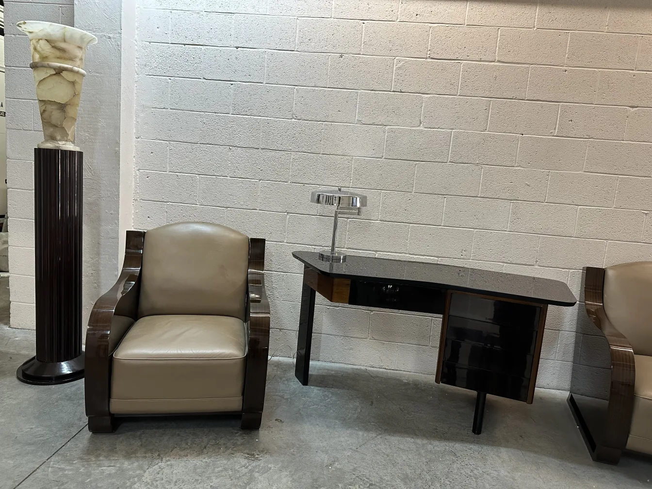 antique desk with lamp and leather chair in modern setting