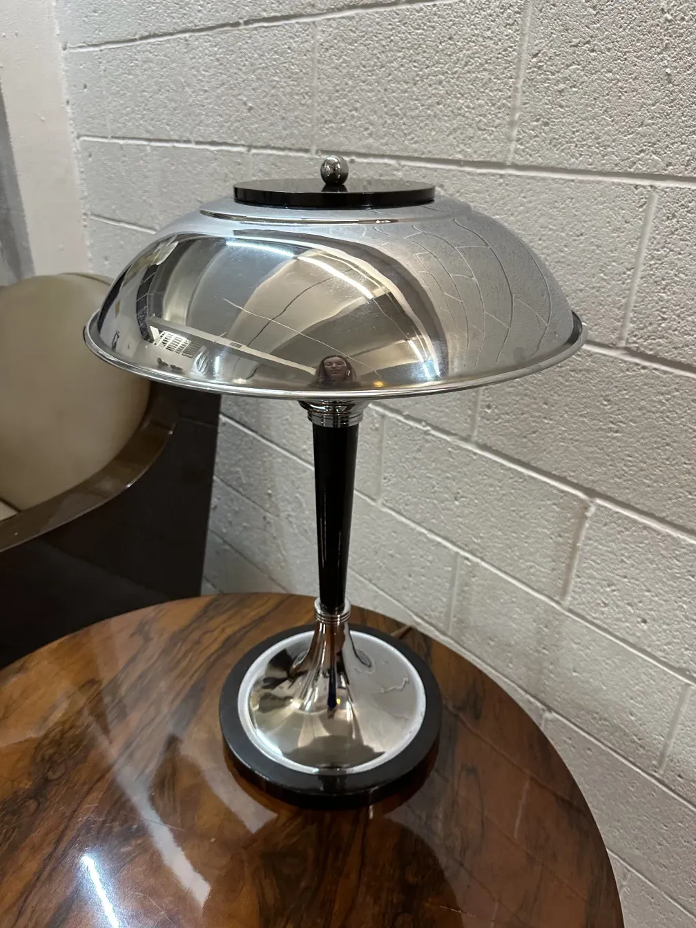 two antique table lamps featuring an elegant design and shiny base