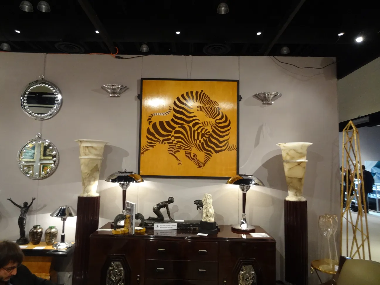 two antique table lamps with elegant bases in a modern room