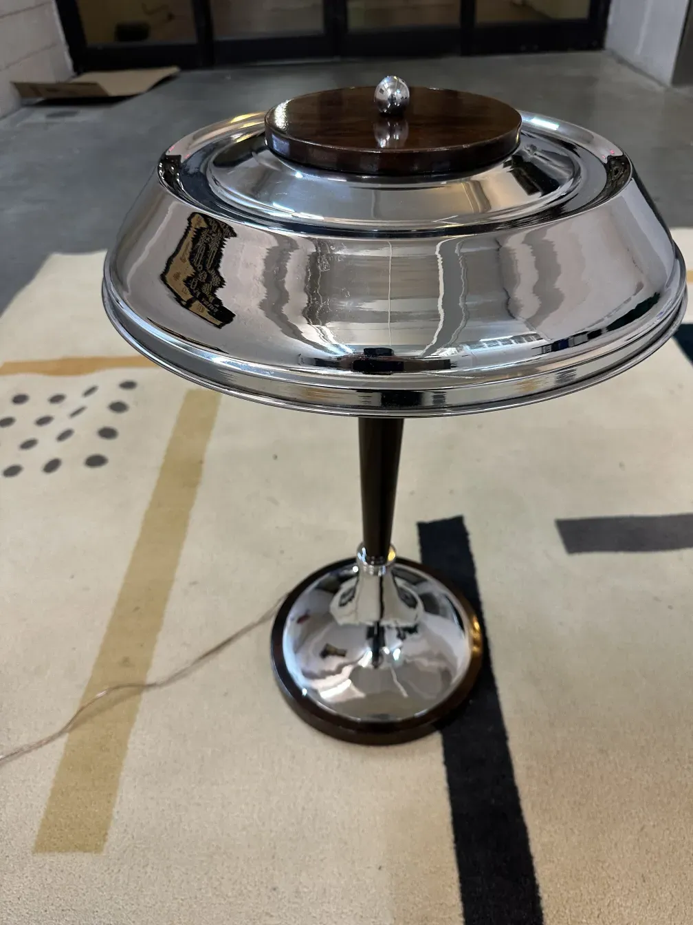 2 antique table lamps with elegant bases, shiny reflections, in a cozy setting.