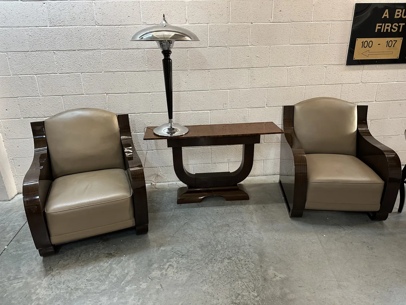 2 antique table lamps in an elegant setting with armchairs