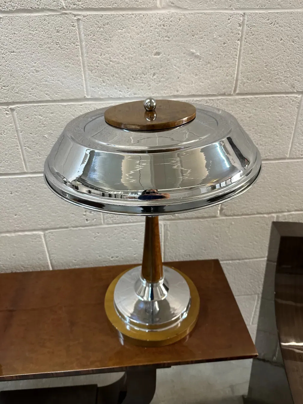 two antique table lamps with circular base and shiny shade, modern ambiance