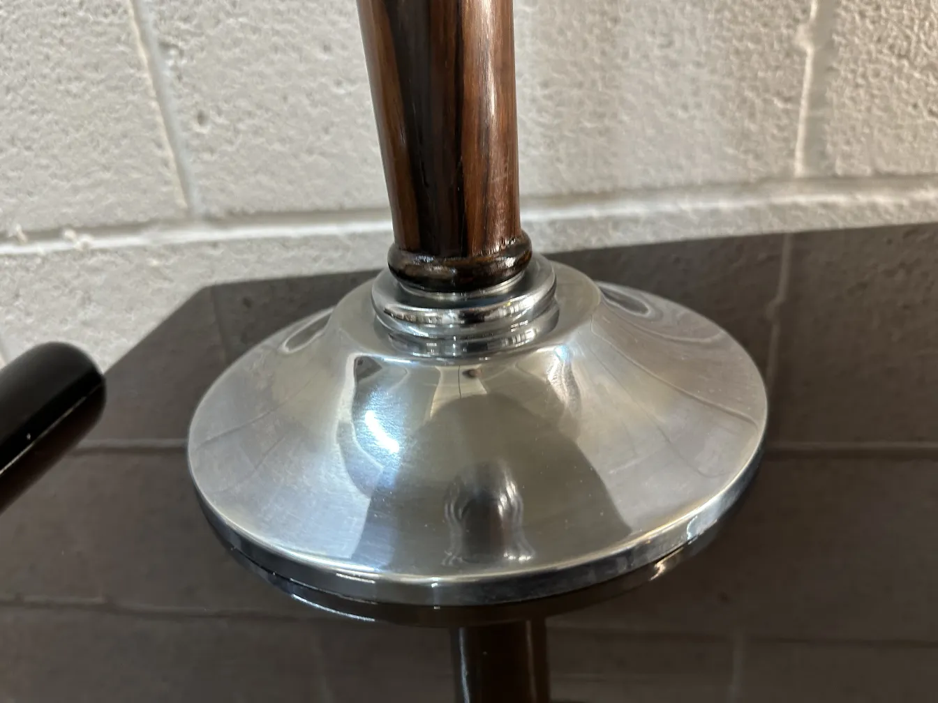 Base of an antique table lamp with elegant design, neutral background