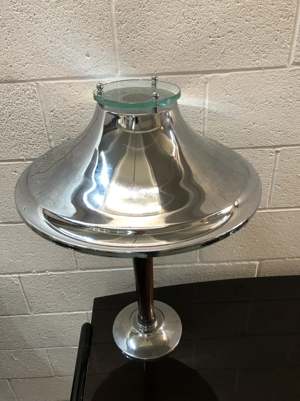 Shiny antique table lamp with elegant details, soft lighting.