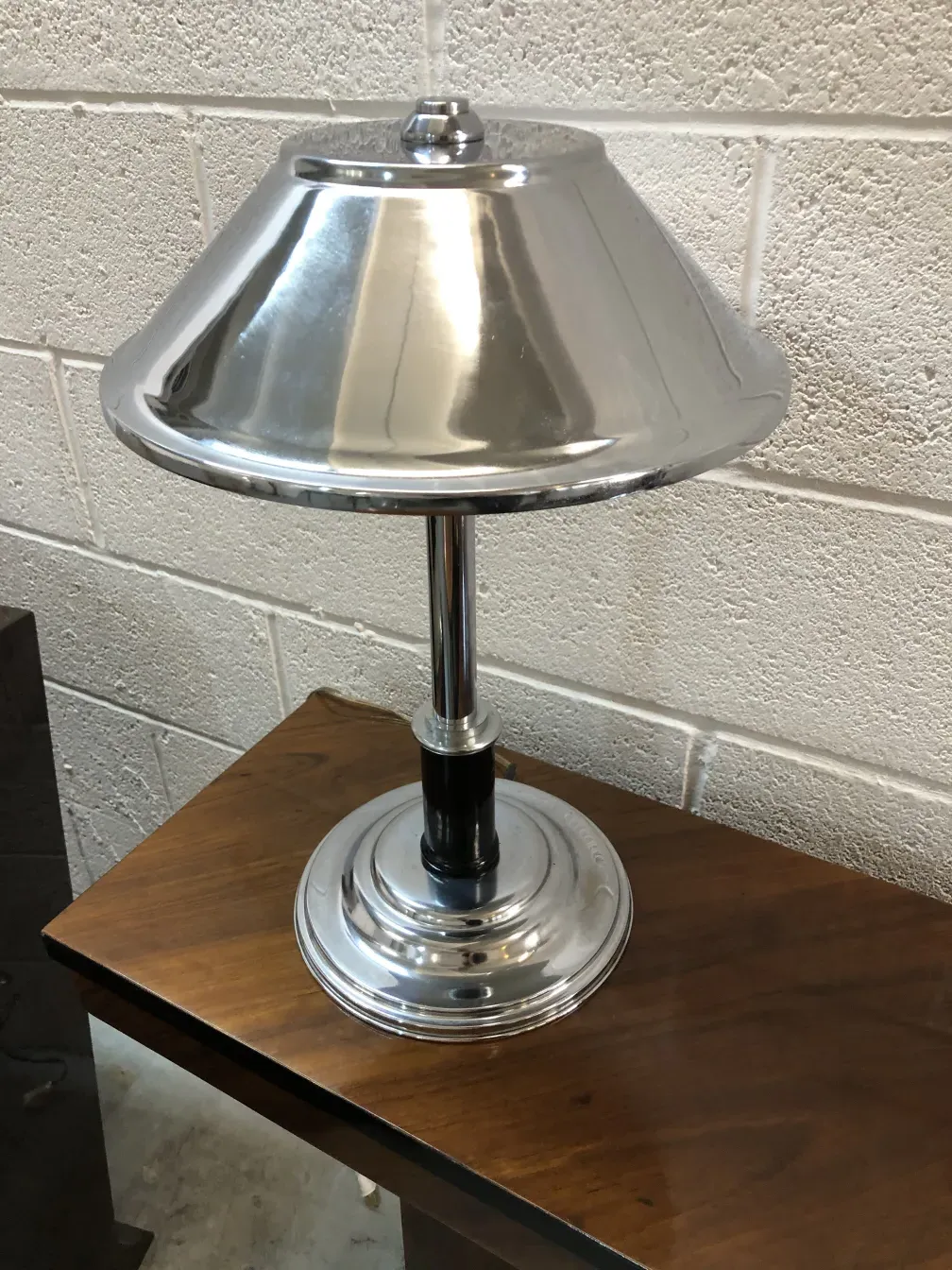 antique table lamp with shiny base, modern setting