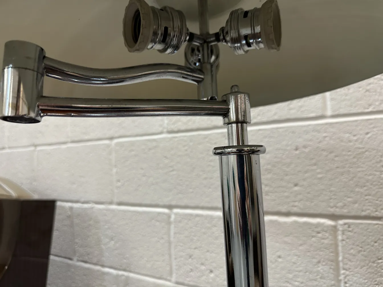 details of an antique table lamp with metal arms