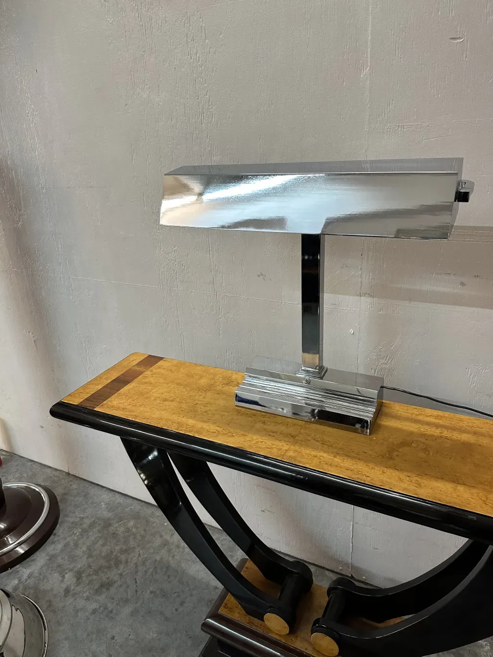 Antique table lamp with a chrome design on a stylish table