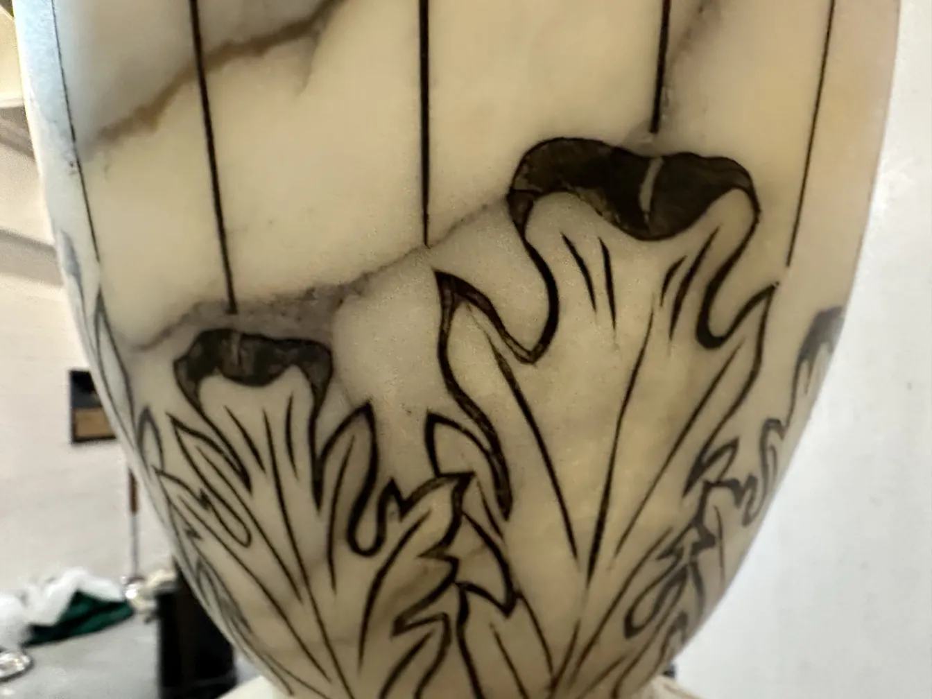 detail of 2 antique floor lamps featuring floral design