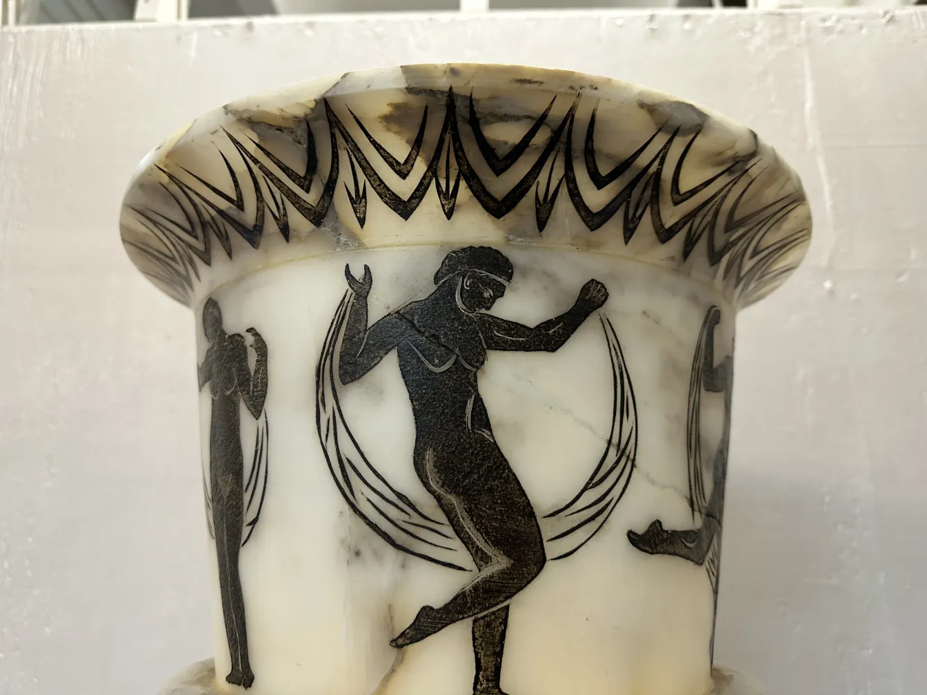 two antique floor lamps decorated with greek figures