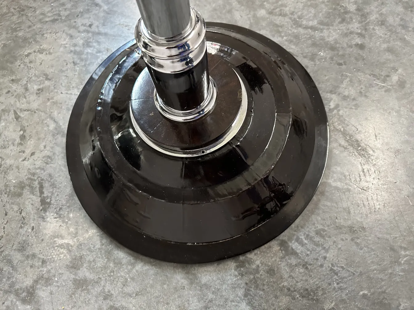 Base of two antique floor lamps in a neutral setting